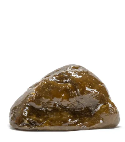 Close-up view of hash rosin showing its texture and color.