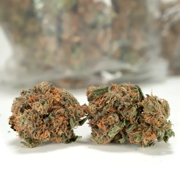 2 real life photos for grease monkey weed with a bag of grease monkey weed in the background